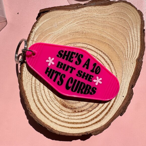 She's A 10 But She Hits Curbs Motel Keychain - Picture 2 of 2